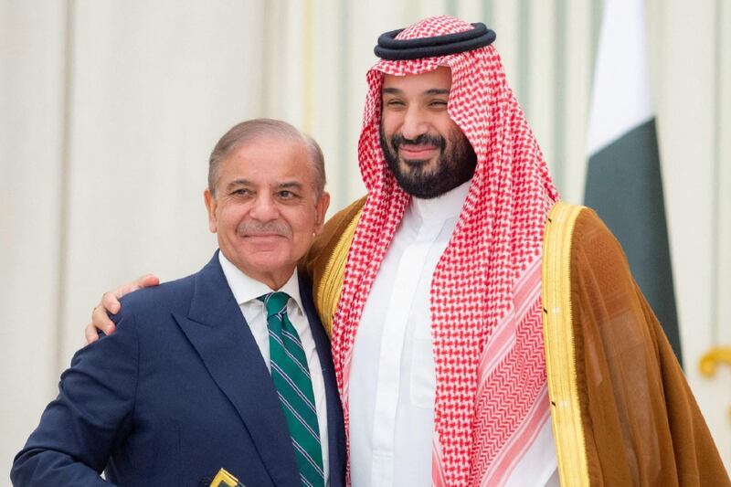 Saudi Crown Prince Mohammed bin Salman and Pakistan Prime Minister Shehbaz Sharif embrace each other on the day they sign a defence agreement, in Riyadh, Saudi Arabia, September 17, 2025.