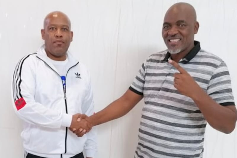Promoter Tshele Kometsi and manager Mlandeli Tengimfene shake hands after an agreement over Zolani Tete yesterday.
